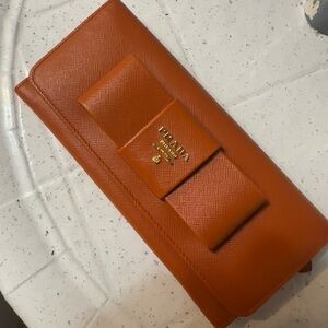 Authentic Prada Orange Saffiano Leather Bow Clutch